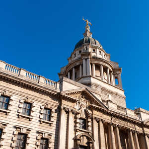 The Old Bailey, London, in front of a vibrant blue sky